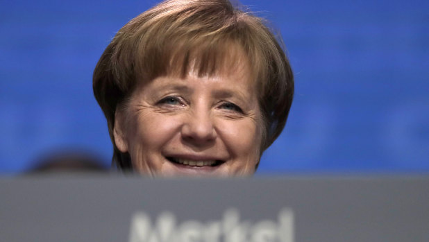 German Chancellor  Angela Merkel smiles at the party convention of the Christian Democratic Union CDU in Berlin.
