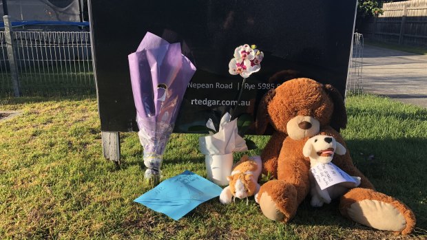 Tributes left outside the Alma Street home on Friday morning. 