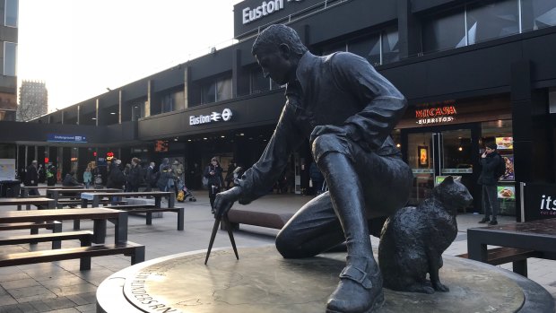 The statue of Matthew Flinders and his cat Trim at Euston station in central London.