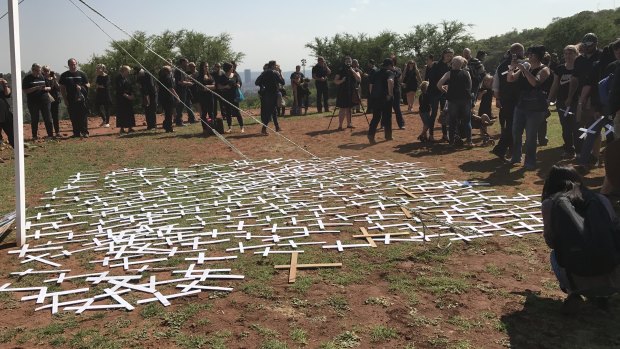 Protesters lay cross symbols on the ground during a demonstration by South African farmers and farm workers at the Voortrekker monument in Pretoria last October.