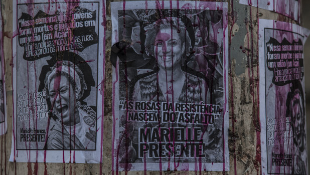 Posters depicting councillor Marielle Franco on a wall the day after she was murdered, in Rio.