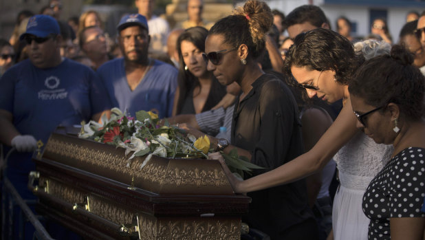 Marielle Franco's relatives grieve during her burial in Rio de Janeiro, Brazil, 