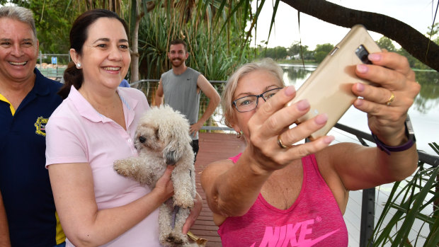 Ms Palaszczuk is seen posing for a photo while walking through Riverside Park in Townsville.