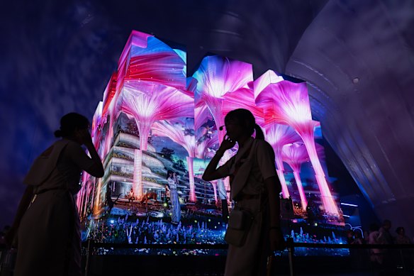 Visitors walk past a display in the PASONA Natureverse Pavilion during Expo 2025 in Osaka, Japan.