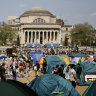 Students protesters gather at their encampment on the Columbia University campus.