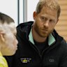 Prince Harry meets a person who was wounded in the war with Russia at the Superhumans Centre in Ukraine.