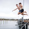 Boys jump off Mornington Pier.