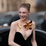 Hunter Schafer’s slicked-back bun highlighted her bold gilded jewellery at a recent Schiaparelli haute couture show.