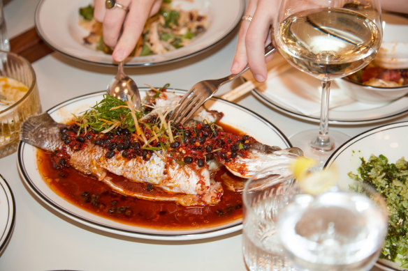 Steamed market fish in chilli and black bean broth.