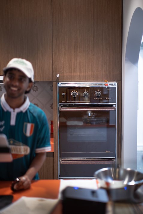 A vintage oven by the window is for show.