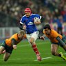France’s Louis Bielle-Biarrey, center, runs with the ball during the rugby union Nations Series match between France and Australia in Saint-Denis, outside Paris, Saturday, Nov. 22, 2025. (AP Photo/Christophe Ena)