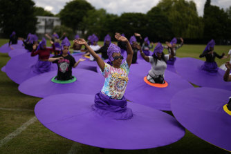 Members of the Mahogany Carnival group rehearse for the upcoming Platinum Jubilee pageant at Queens Park Community School in north London.