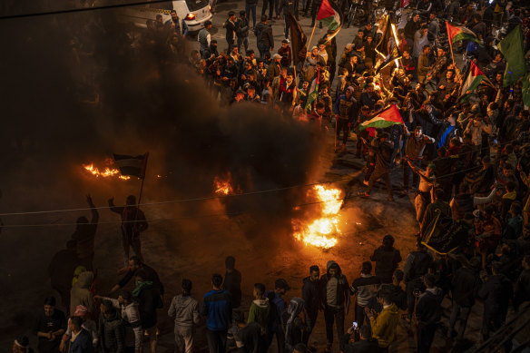 Palestinians celebrate after a shooting attack near a synagogue in Jerusalem, in Gaza City on Friday night.