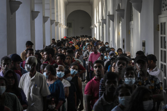 People throng President Gotabaya Rajapaksa’s official residence three days after it was stormed by anti government protesters in Colombo in Colombo, Sri Lanka, on Tuesday.