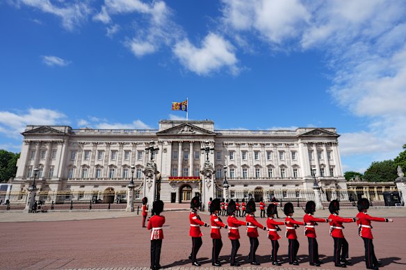 Soldiers of the Coldstream Guards march to their positions outside Buckingham Palace.