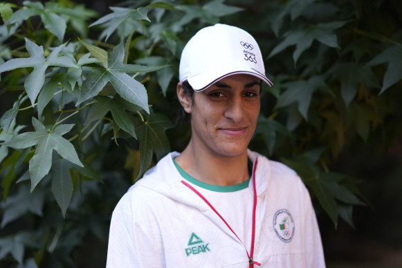 Algerian boxer Imane Khelif poses for a photo after an interview.