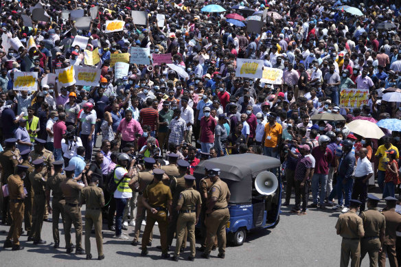 Workers representing government institutions participate in a protest against Sri Lankan President Ranil Wickremesinghe’s tax policy in Colombo in February.