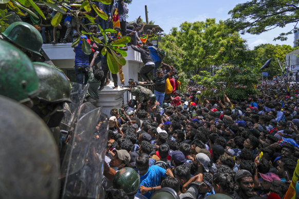 Protesters storm the Sri Lankan prime minister’s office in July. 