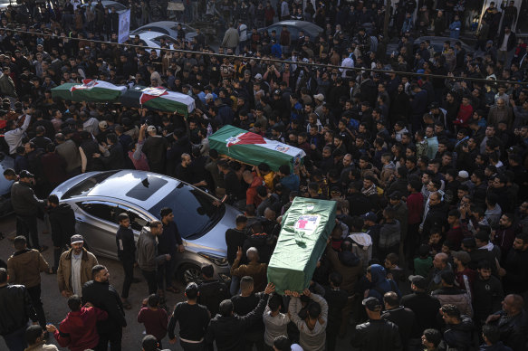 Palestinians carry the bodies of four Palestinian migrants who died off the Tunisian coast, in Rafah in the southern Gaza Strip on Sunday.