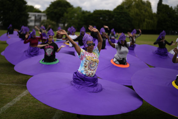 Members of the Mahogany carnival group rehearse for their upcoming performance at the Platinum Jubilee Pageant, at Queens Park Community School in north London.