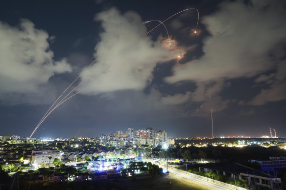 Rockets from the Israeli Iron Dome air defence system manoeuvre to intercept a rocket fired from the Gaza Strip, in Ashkelon, Israel.