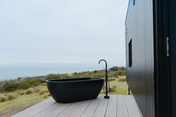 Each cabin has an outside bath with spectacular views.