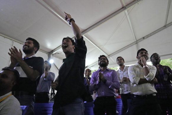 Indian Space Research Organization (ISRO) staff celebrate the successful landing of spacecraft Chandrayaan-3 on the moon.