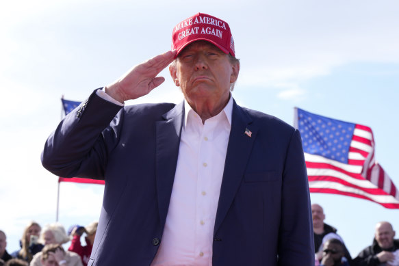 Republican presidential candidate and former president Donald Trump salutes at a campaign rally in Vandalia, Ohio.