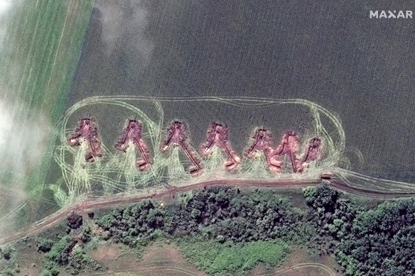 This satellite image provided by Maxar Technologies shows towed artillery in firing position deployed in the north of Lyman, Ukraine.