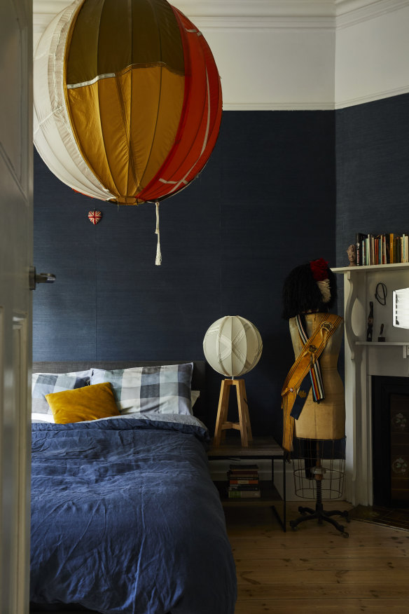 “We wanted a calm, moody sleeping space and blue is our favourite colour,” says Delany. 
“I love the texture of this wallpaper – it reminds me of being a child in the 1970s.”