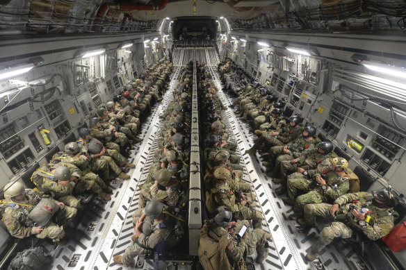 Special operations forces  conduct an airborne insertion during the Rim of the Pacific exercise.