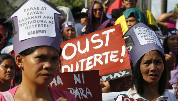 Protesters march towards the Presidential Palace in Manila, Philippines, to  protest against Philippine President Rodrigo Duterte.