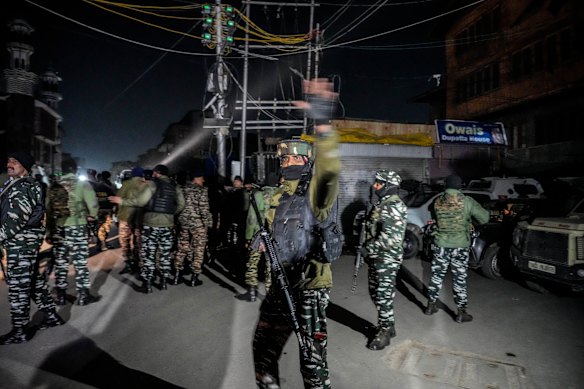 Indian paramilitary soldiers arrive at the site of a shootout in Srinagar, Indian controlled Kashmir.