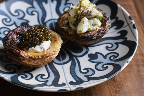Blue swimmer crab egg tart (right) and cauliflower egg tart with caviar.