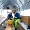 Inside the ice fishing tent.