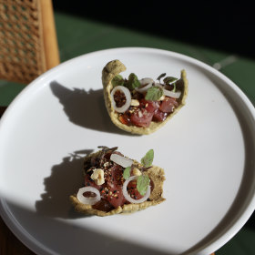 Nori crackers with raw fish and ponzu.