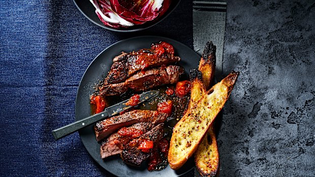 This easy steak dish is packed with flavour thanks to roasting tomatoes with anchovies and garlic.