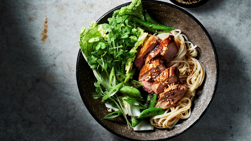 Recipes share a bold crunch-topped pork noodle dish for quick weeknight cooking