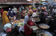 Shoppers at a fried food stall at Karangayu Market in Semarang, Central Java.