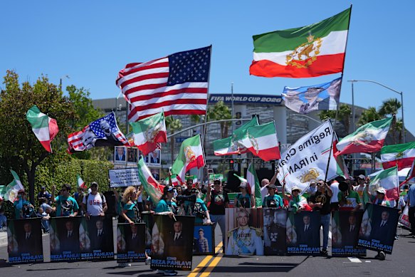 People protest outside Los Angeles Stadium before the World Cup match between Iran and New Zealand.
