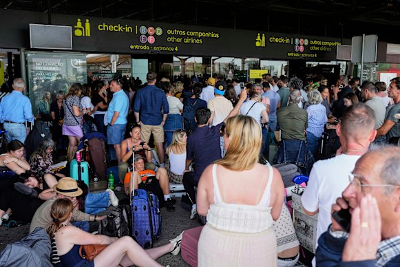 Passengers who are waiting outside Lisbon airport during power outages worldwide.
