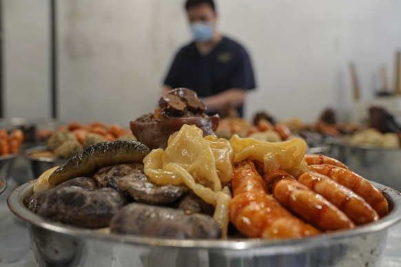 Chef Fong Wah-yat prepares dishes for Hong Kong residents to celebrate Lunar New Year’s eve at home due to COVID restrictions on restaurants.