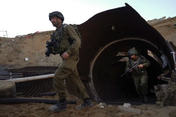 Israeli soldiers exit a tunnel that the military says Hamas militants used to attack the Erez crossing.