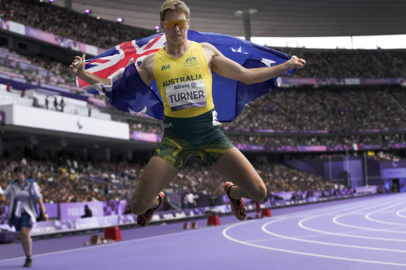 James Turner celebrates a second gold medal at the Paris Games.