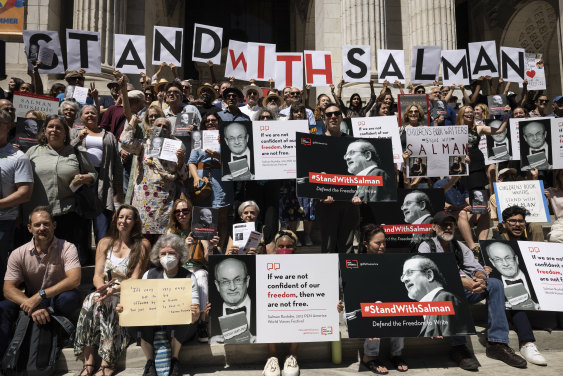 A group of writers and supporters gather in solidarity with Salman Rushdie outside the New York Public Library, a week after he was attacked and seriously injured.