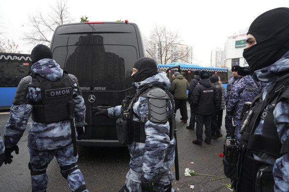 Riot police guards next to a van with the coffin of Russian opposition leader Alexei Navalny.