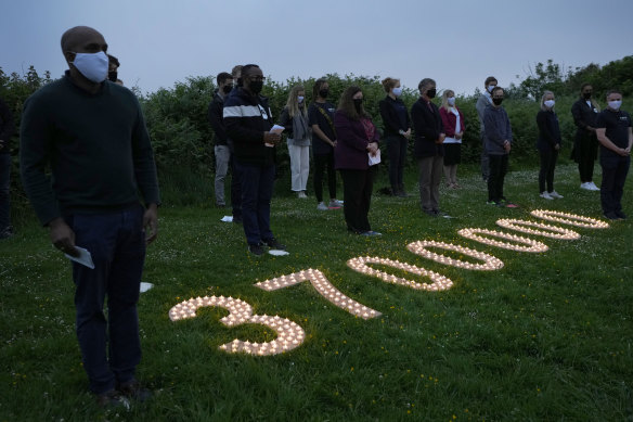 Campaigners attend a vigil in Falmouth, Cornwall, near the G7 summit in Carbis Bay, to remember the millions who have already died during the pandemic. 