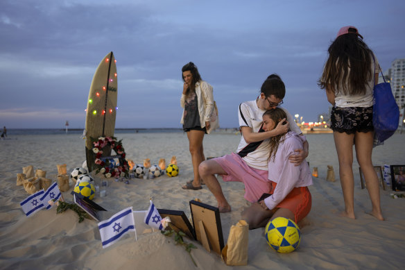 Friends of those killed during Hamas’ October 7 attack on the Nova Music Festival in southern Israel staged a vigil for the victims at the beach in Tel Aviv, Israel.