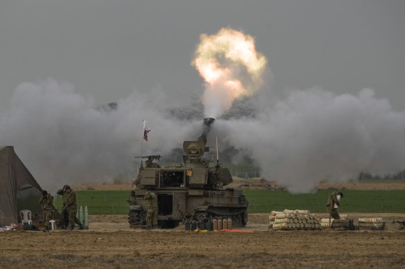 An Israeli mobile artillery unit fires a shell from southern Israel towards the Gaza Strip on Sunday.
