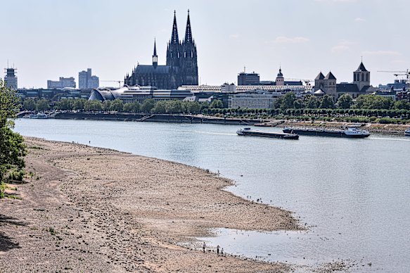 Cargo ships navigate the exposed sandbanks of the Rhine in Cologne, Germany, on Monday.